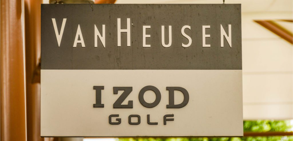 Van Heusen and Izod sign hanging outside of a store