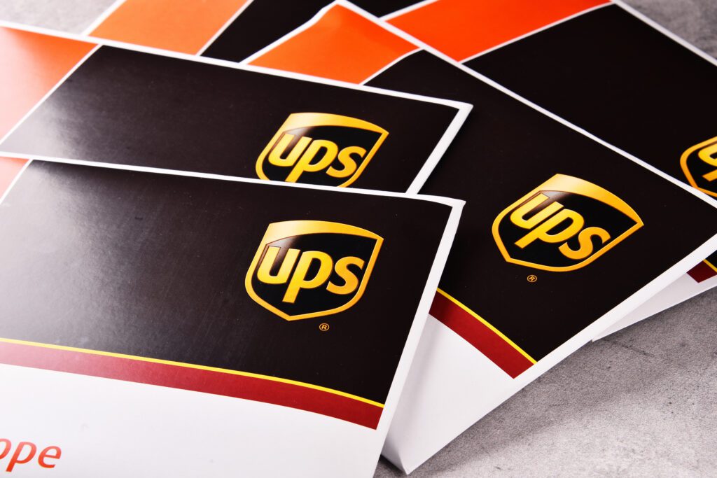 In its fiscal Q1 2026, which ended March 31, United Parcel Service (UPS) revenue totaled $21.2 billion amid fuel cost surges and surcharges. | Image credit: monticellllo - Adobe Stock
