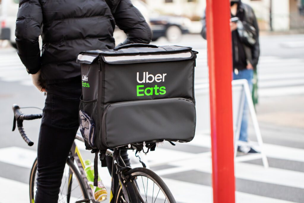 Multiple retailers have joined the Uber Eats marketplace to enable third-party last-mile delivery from their physical store locations. | Image credit: yu_photo - Adobe Stock